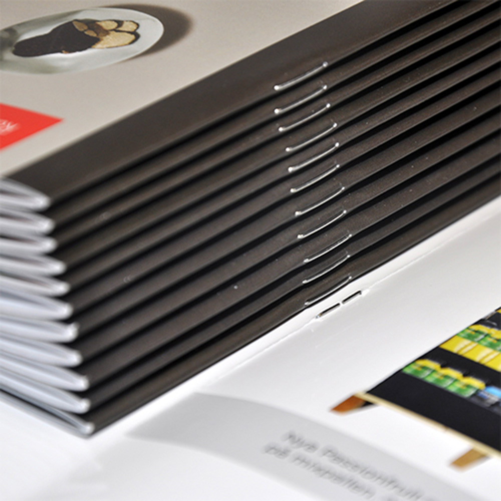 Encuadernación de catálogos y revistas: grapa, grapa omega, espiral Wire-O y encolado (Guía 2026)
